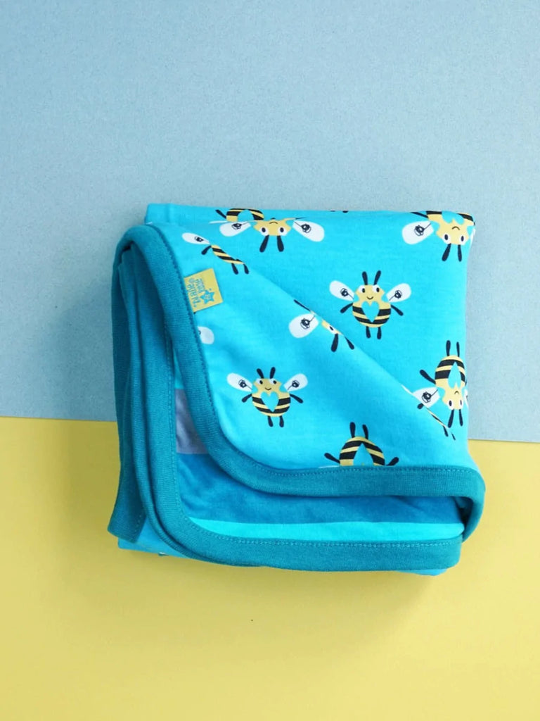 Blade & Rose Buzzy Bee Blanket - bold, bright and fun! This gorgeous blanket is made from soft cotton and features a blue and yellow buzzy bee design on one side and contrasting stripes on the reverse. Sold by Say It Baby Gifts