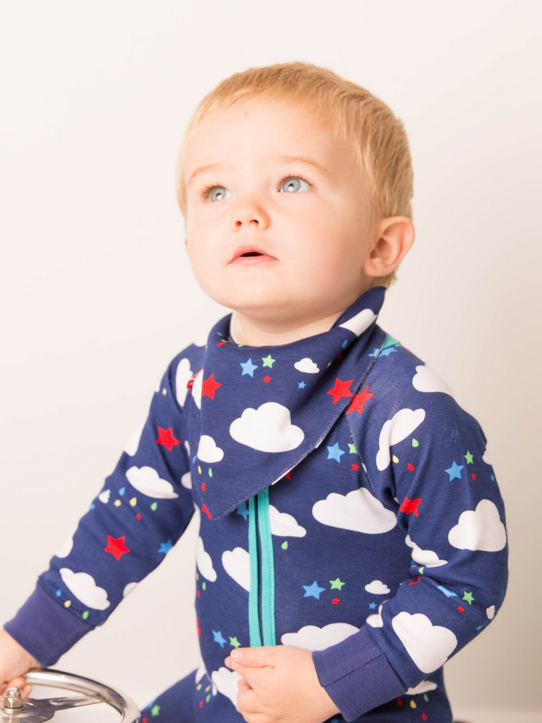 Blade & Rose Weather Zip Up Romper - bold, bright and fun! This fab romper is navy blue with contrasting teal zip and the cutest weather design of fluffy white clouds and multi-coloured stars and raindrops.