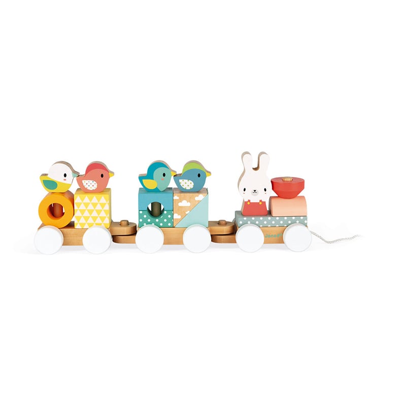Janod Pure Train for age 12 months plus. The toy includes 17 blocks in soft colours with different geometric shapes that help baby learn colours, shapes and animals whilst also making their first constructions by stacking onto the train or independently.
