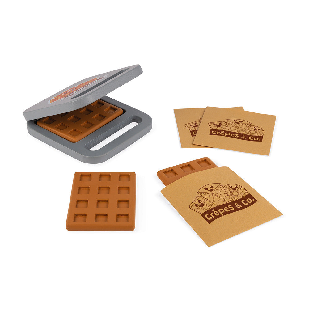 Janod Crepes & Co Waffle House. 40 Accessories include: 1 cash register, 1 set of coins and notes, 1 waffle iron, 3 waffles, 3 donuts, 1 box of 4 eggs, 1 jar of spread, 3 crêpes, 3 'fillings' for the crêpes, 1 bowl, 1 whisk, 1 crêpe rake, 9 pieces of sliced fruit, 1 pair of tongs, 3 Kraft paper bags , 2 cardboard boxes of food and 1 box of chalk.