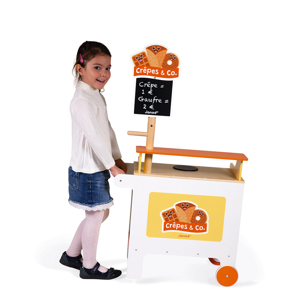 Janod Crepes & Co Waffle House. With wheels integrated into the stands design, it's easy to move around for play and it also has a handy storage area underneath to keep it looking tidy and to keep all the many accessories!