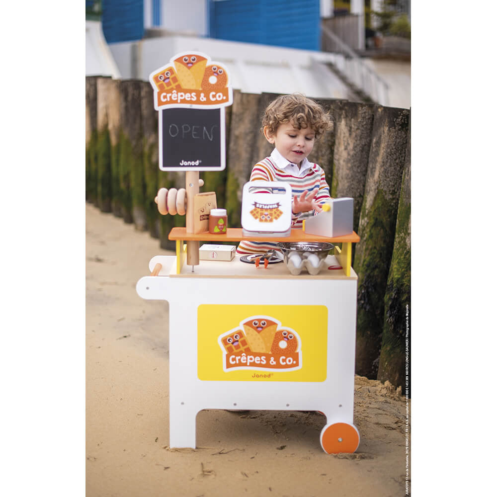 Janod Crepes & Co Waffle House. This fab pop-up food stand has everything included that kids will need to run a fantastic food stall including utensils, bowl, waffle press, eggs, food, toppings, cash register, money and more! It even has a little wooden chalk board and chalk to write the daily"Specials" on! A fantastic wooden gift that will encourage and develop free play and imagination!