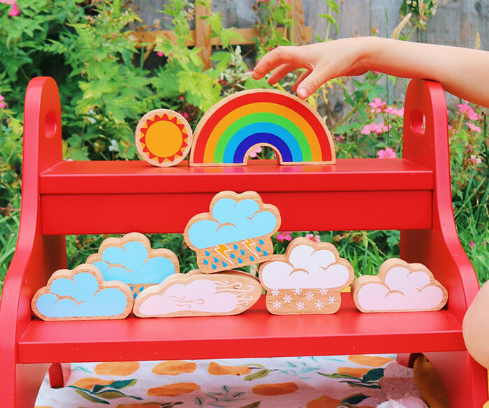 Lanka Kade weather playset. Bright and colourful, this set comprises of 8 weather pieces including clouds, rain, sun and a rainbow which can be used in everyday play activities to encourage discussion and learning about weather as well as stacking and free play.