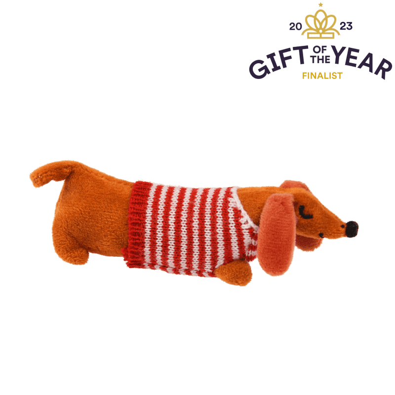 Rex London. This mini sausage dog in a little box soft toy is just so adorable with his striped shirt and red polka dot blanket! Sold by Say it Baby Gifts